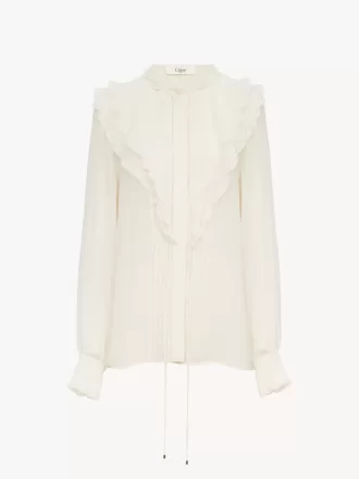 Blusa con volantes en georgette de seda