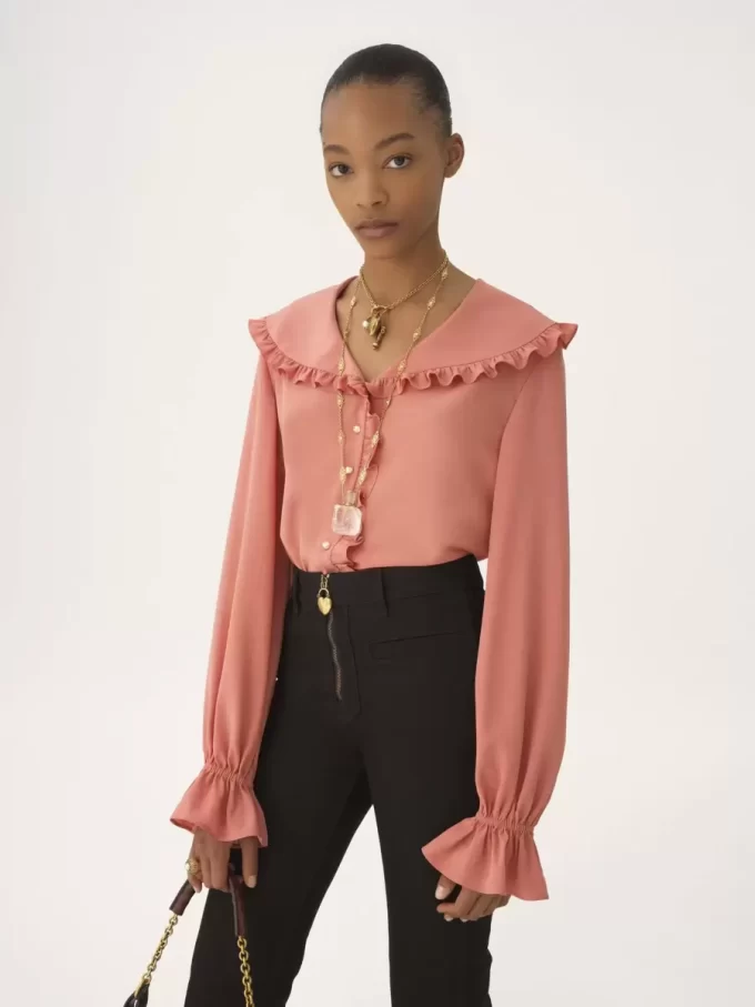 Blusa fluida con volantes en crepé de China