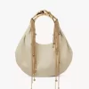 Bolso hobo Twisted Shell en piel brillante Bolso hobo Twisted Shell en piel brillante