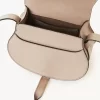 Bolso pequeño Marcie tipo sillín de piel brillante