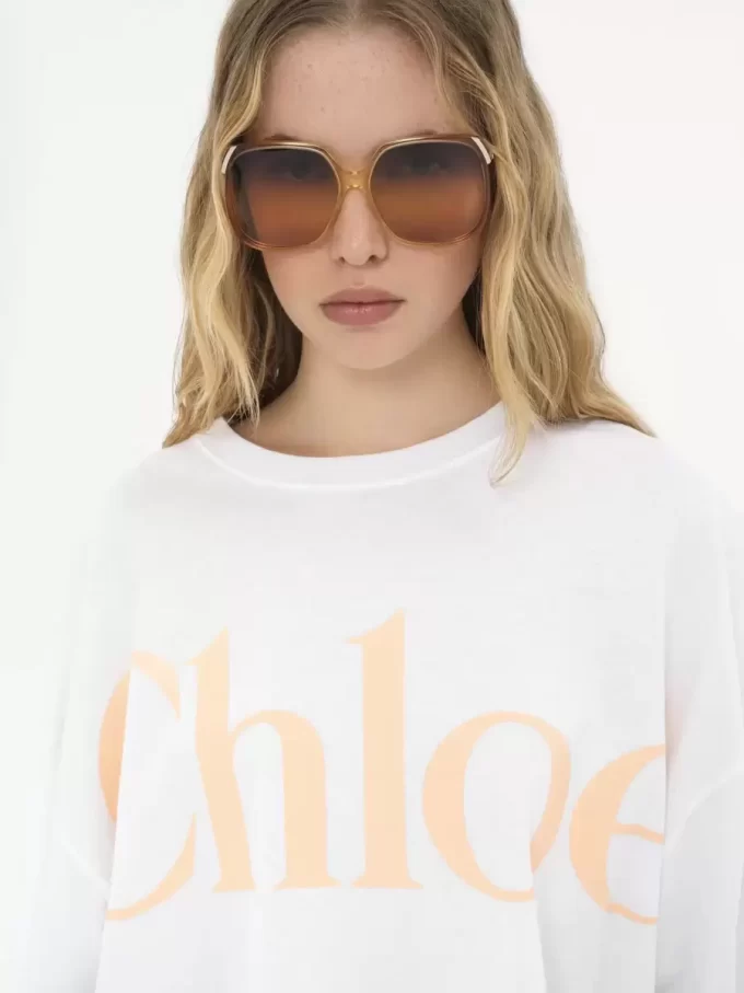 Camiseta oversize con logo recortado en jersey de algodón