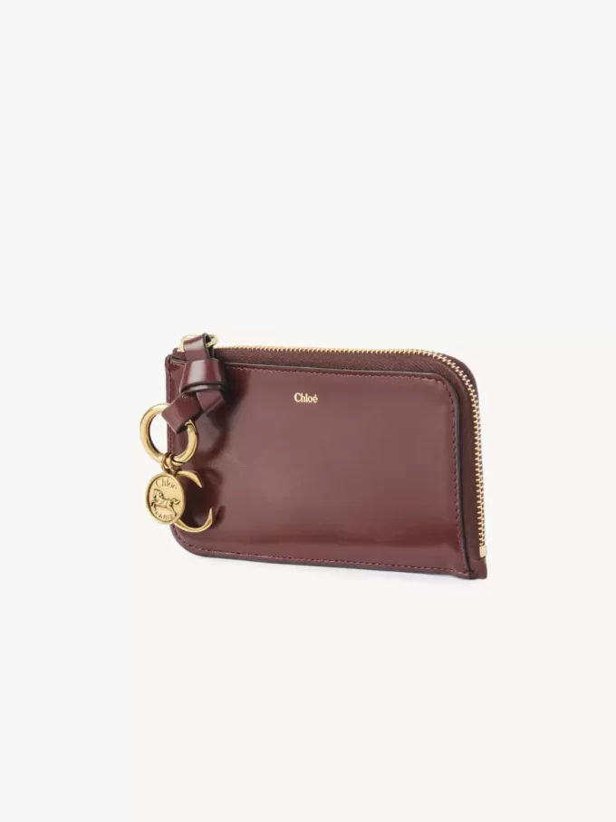 Cartera con alfabeto en piel brillante Cartera con alfabeto en piel brillante