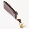 Cartera con alfabeto en piel brillante Cartera con alfabeto en piel brillante