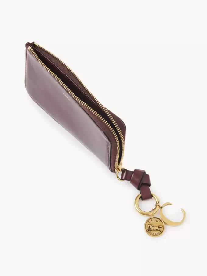 Cartera con alfabeto en piel brillante Cartera con alfabeto en piel brillante
