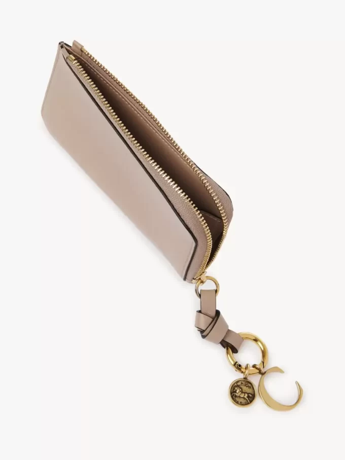 Cartera con alfabeto en piel brillante Cartera con alfabeto en piel brillante