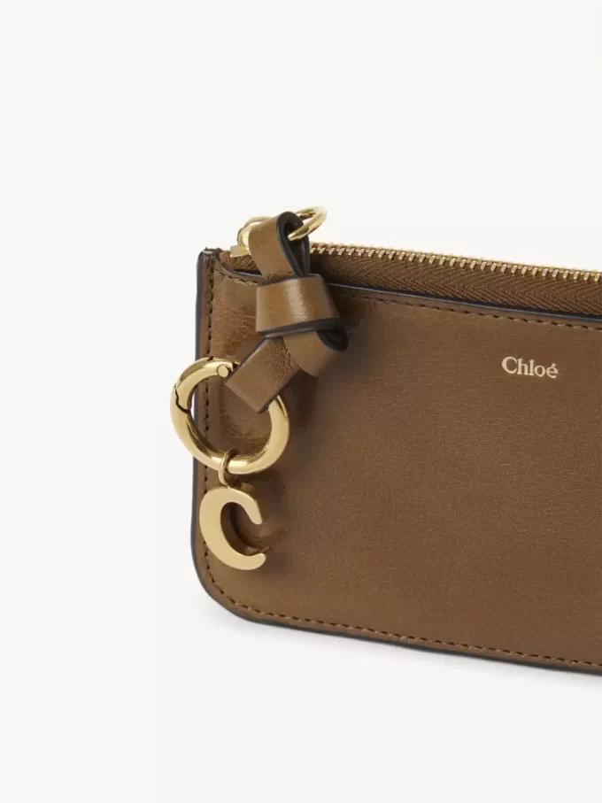 Cartera con alfabeto en piel brillante