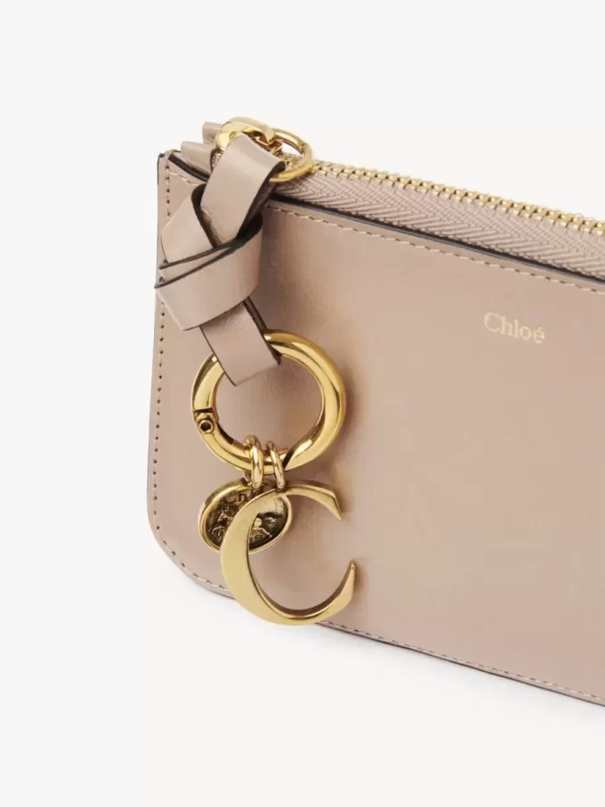 Cartera con alfabeto en piel brillante Cartera con alfabeto en piel brillante