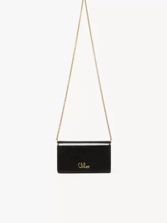 Cartera con solapa y cadena Chloé Iconic en charol