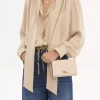 Cartera con solapa y cadena Chloé Iconic en piel brillante