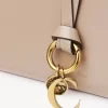 Cartera plegable con alfabeto en piel brillante