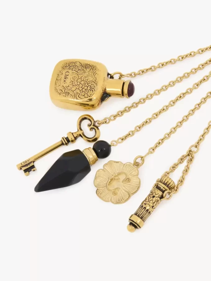 Charm Château Treasures en latón y resina