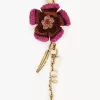 Charm para bolso con forma de flor en rafia y metal Charm para bolso con forma de flor en rafia y metal