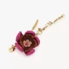 Charm para bolso con forma de flor en rafia y metal Charm para bolso con forma de flor en rafia y metal