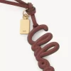 Charm para bolso con logo en piel brillante