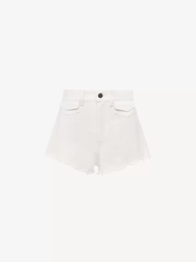 Mini shorts de tiro alto en denim Mini shorts de tiro alto en denim