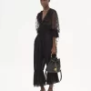 Mochila pequeña de pulsera en piel granulada Mochila pequeña de pulsera en piel granulada