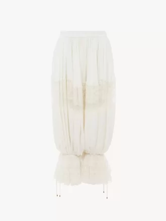 Pantalones fluidos cropped en charmeuse de seda y encaje