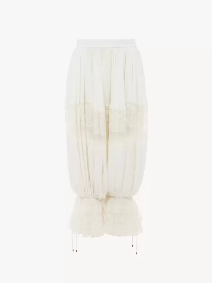 Pantalones fluidos cropped en charmeuse de seda y encaje