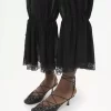 Pantalones fluidos cropped en charmeuse de seda y encaje