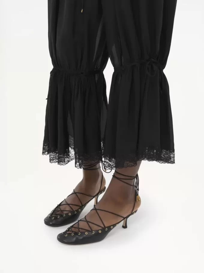 Pantalones fluidos cropped en charmeuse de seda y encaje