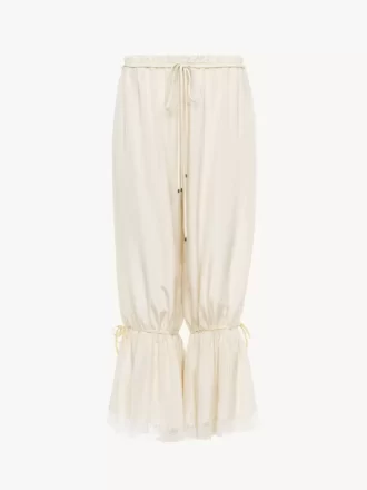 Pantalones fluidos cropped en pongé de seda lavada y encaje