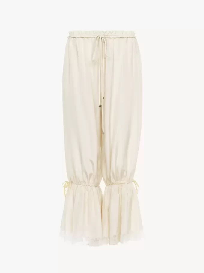 Pantalones fluidos cropped en pongé de seda lavada y encaje