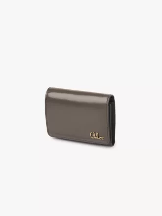 Pequeño bolso Chloé Iconic de tres pliegues con bolsillo para monedas en piel brillante