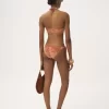 Top de bikini con detalles metálicos
