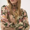 Top de cuello alto abotonado en jersey de lana Top de cuello alto abotonado en jersey de lana