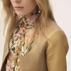 Top de cuello alto abotonado en jersey de lana Top de cuello alto abotonado en jersey de lana