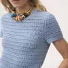 Top de cuello redondo con logotipo en punto de crochet de algodón Top de cuello redondo con logotipo en punto de crochet de algodón