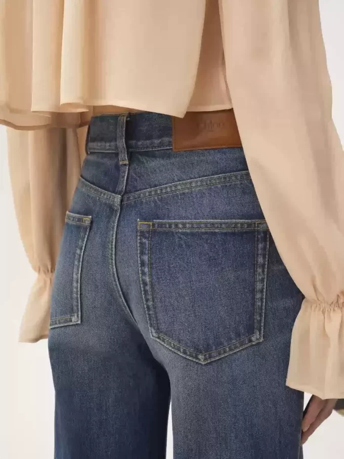 Vaqueros acampanados de tiro alto en denim Vaqueros acampanados de tiro alto en denim
