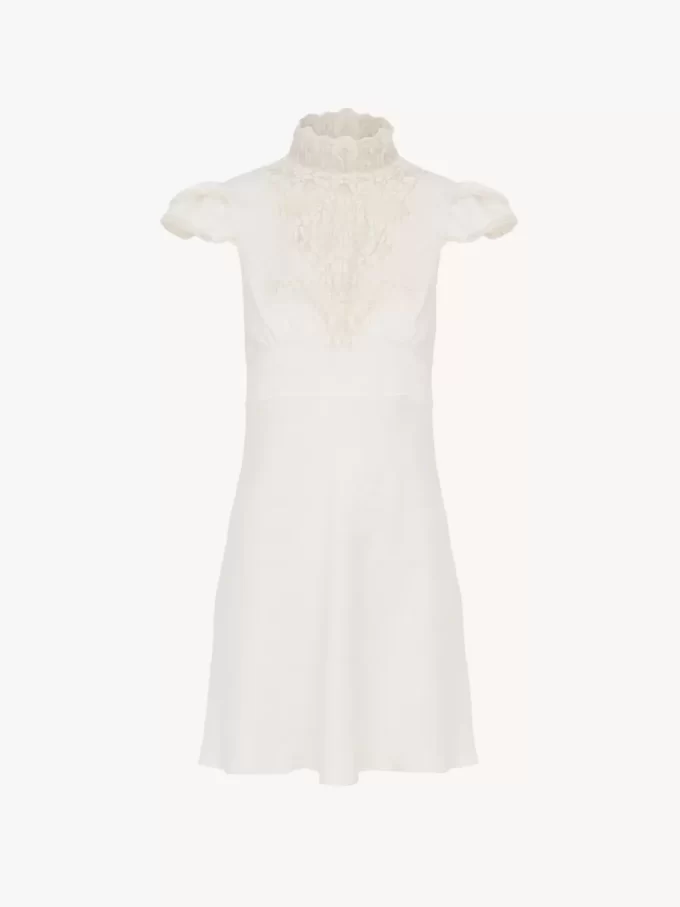 Vestido mini de cuello alto en seda jacquard y encaje
